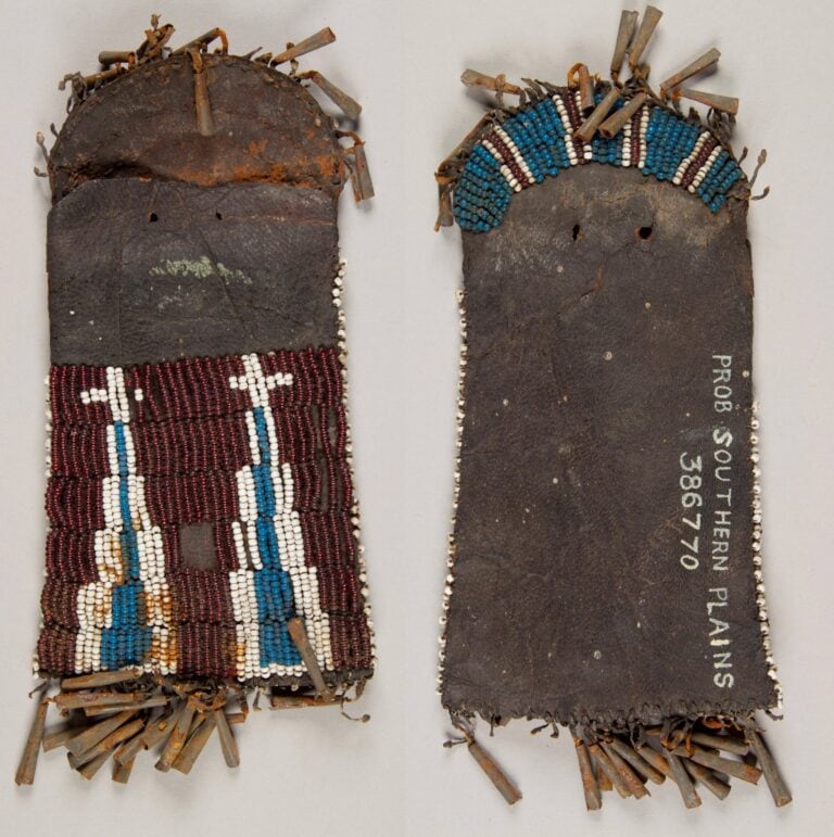 An early strike a light bag. Most likely of Kiowa origin and made before 1850. It is made of commercial cowhide. NMNH (National Museum of Natural History).