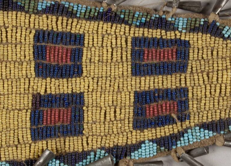A seed beaded bag with greasy yellow seed beads used as a background.