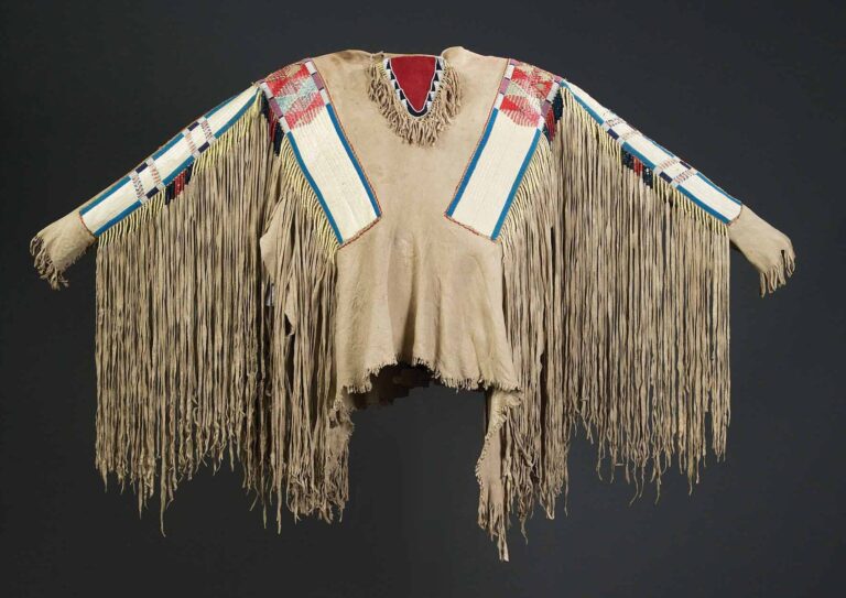 A NezPerce war shirt with quilled strips and leather fringes.