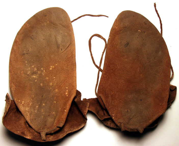 The soft soles of side seam moccasins. NMNH.