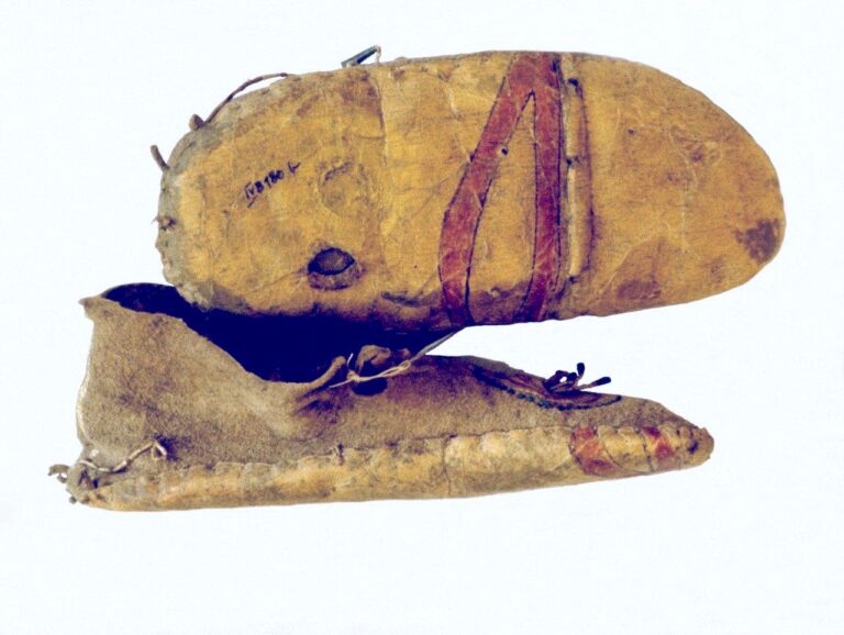 Side seam moccasins with additional rawhide sole, maybe recycled parfleche. Collected by Maxmillian Prinz zu Wied.