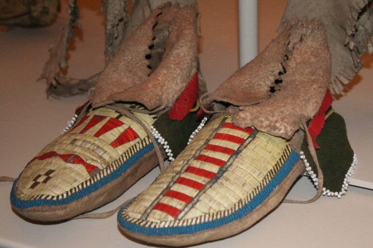 Northern Plains side seam moccasins. Decorated with porcupine quills and seed beads. British museum, London.
