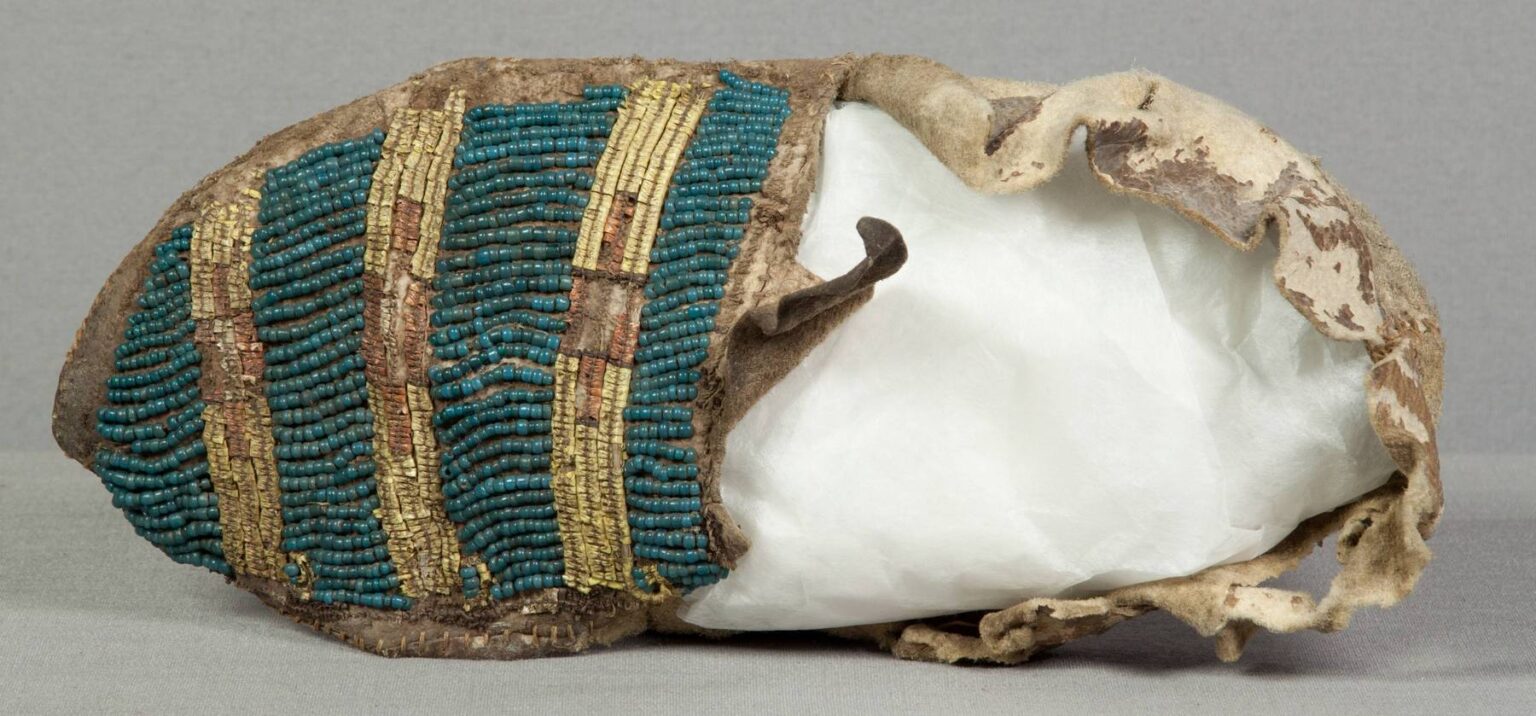 Completely unique moccasins collected by the painter George Catlin sometime in the 1830s. They are decorated with a combined technique of QWHH (double-bundle) and pony beads. NMNH.